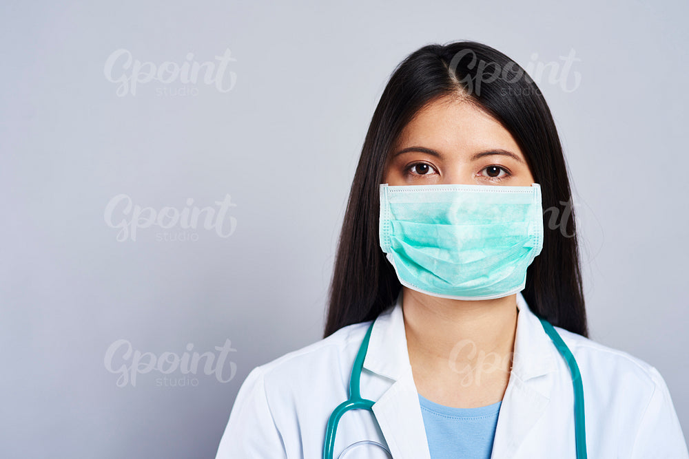 Close up of female doctor in surgical mask