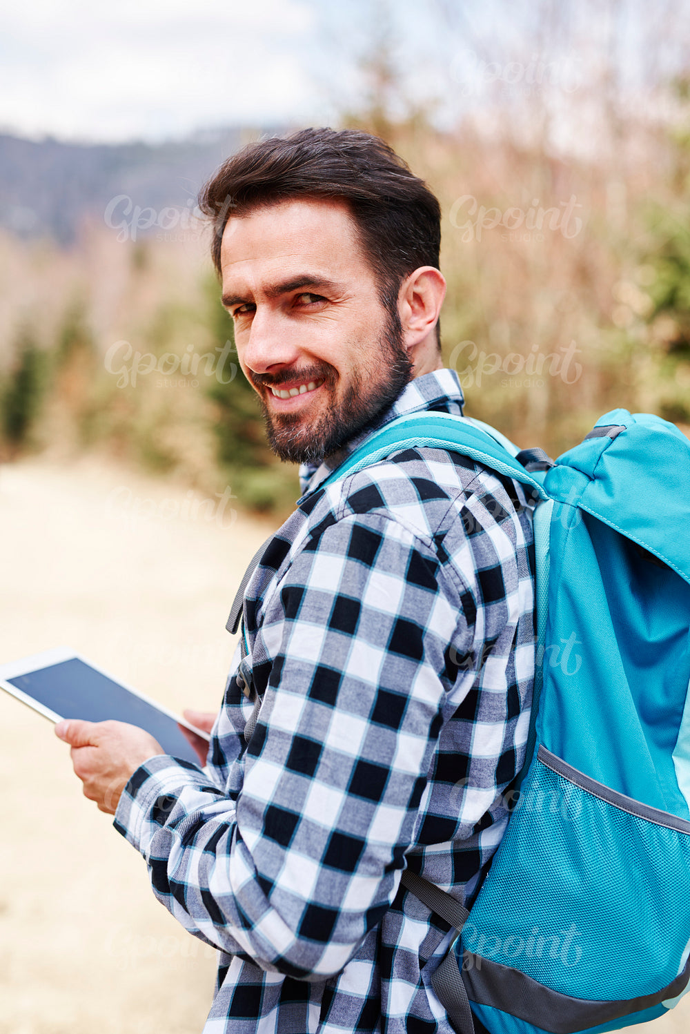 Portrait of smiling male hiker with backpack