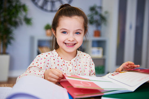 Portrait of smiling child studying at home
