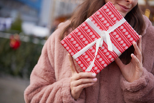 Close up of unrecognizable woman with Christmas gift