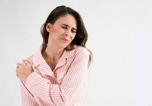 Woman suffering from shoulder pain