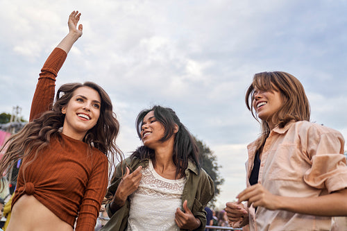 Group of multiracial friends have fun at music festival
