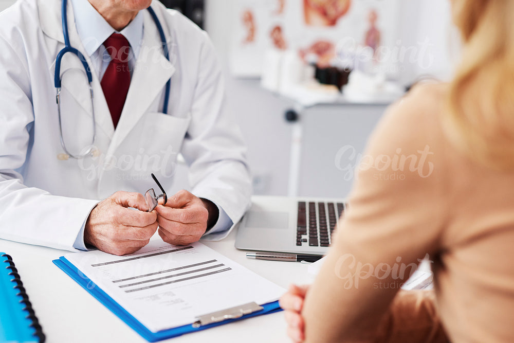 Close up of patient and doctor in doctor's office
