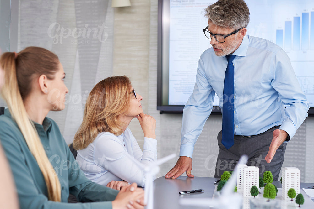 Business people having arguments with boss