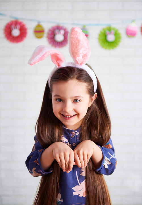 Portrait of playful girl in rabbit costume