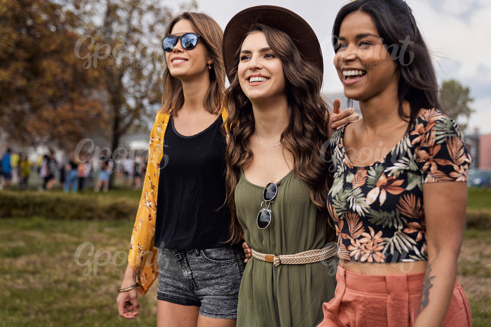 Group of women spending time together at music festival 