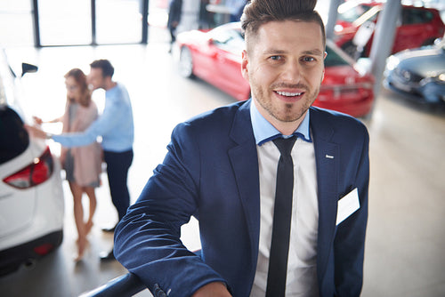 Portrait of salesman in the car dealership