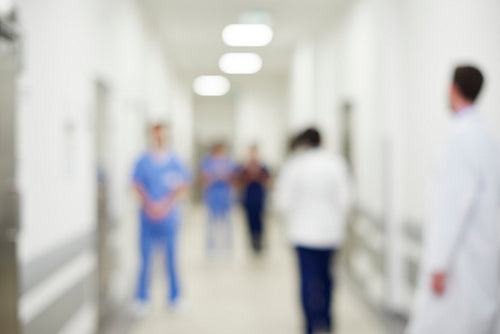 Blurred view of doctors on the corridor in hospital