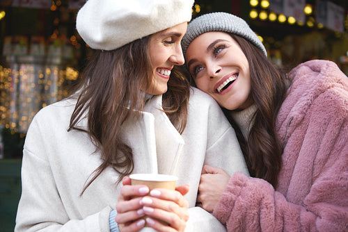 Two best friends enjoying time on Christmas market