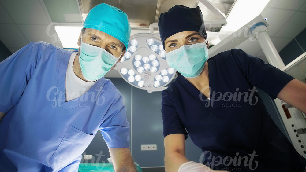 Two surgeons over the operating table