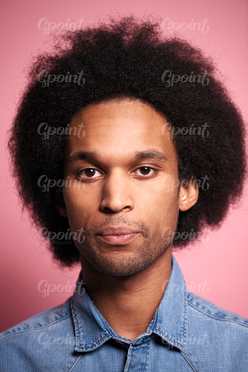 Portrait of young African man in studio shot.