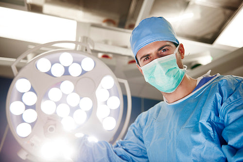 Portrait of confident surgeon in operating room