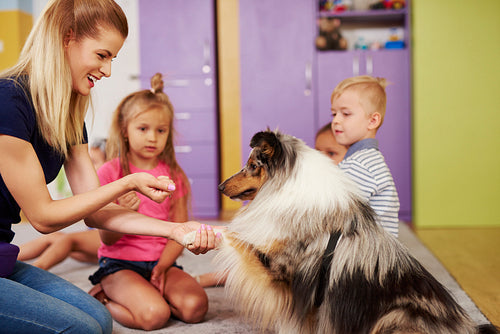 Female therapist and her dog in the preschool
