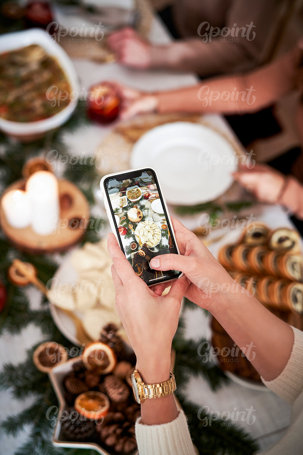 Woman making photo of Christmas's table