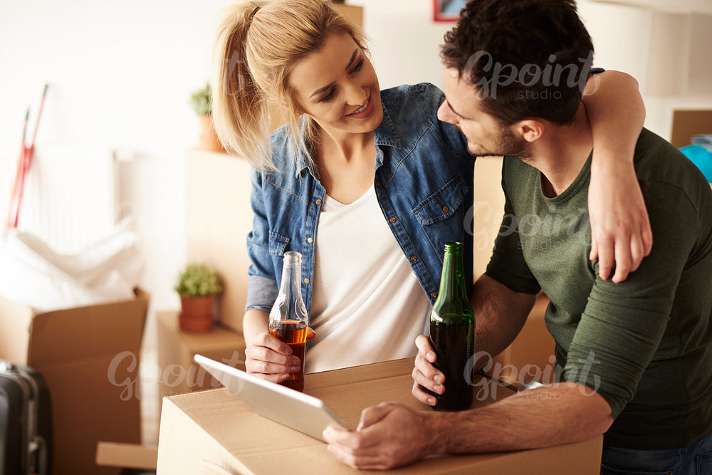 Couple drinking beers and  smiling