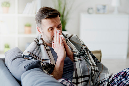 Man with flu staying at home