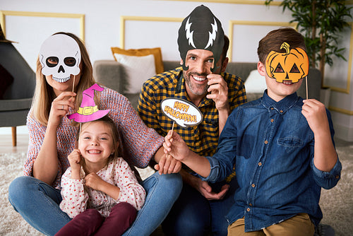 Happy family spending Halloween together at home