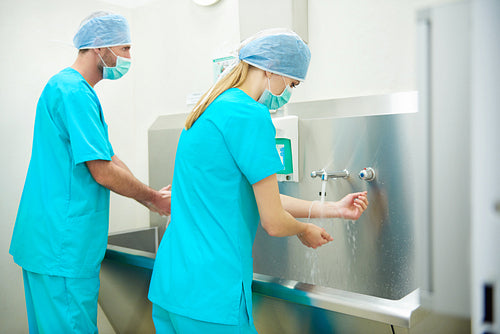 Two surgeons washing their hands