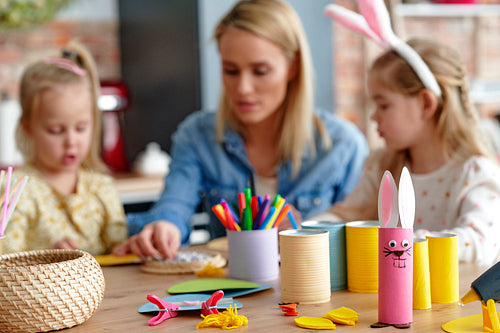 Accessories to make Easter decorations and family in the background
