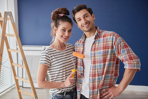 Young couple  ready to paint a room