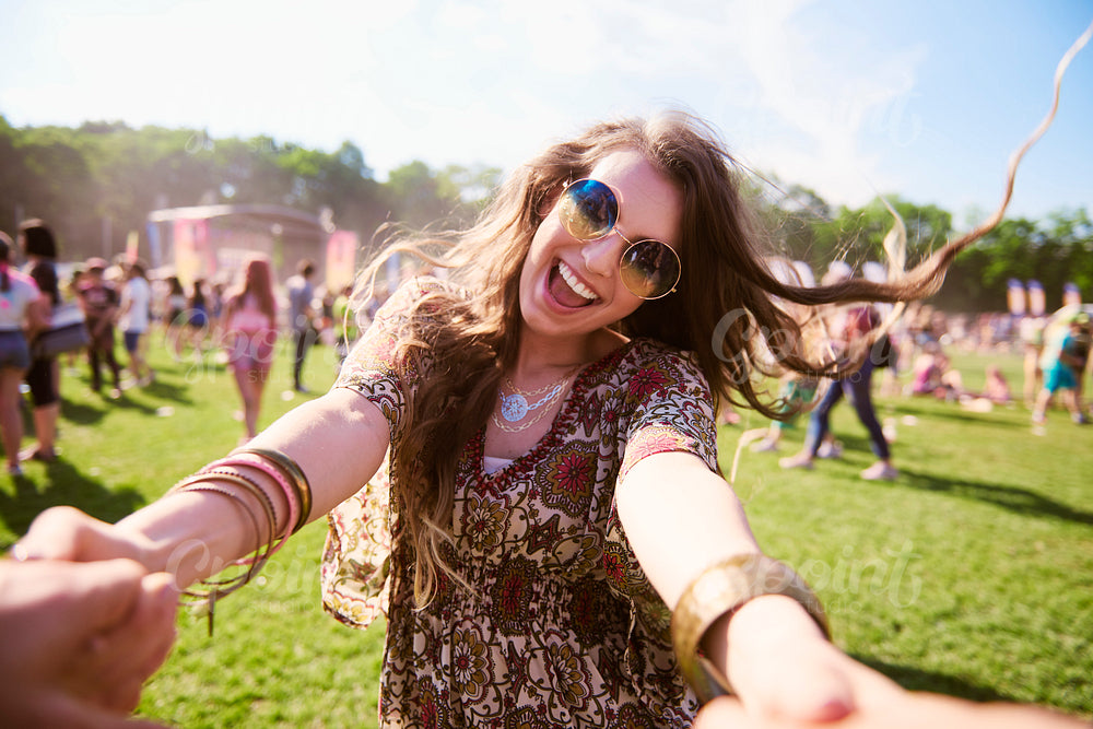 Portrait of young boho woman having fun at festival