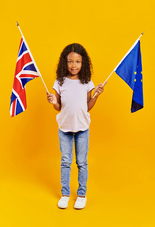 African girl holding British and European Union flags
