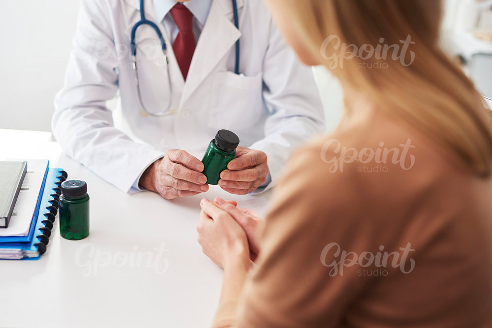 Doctor recommending medicine to the patient