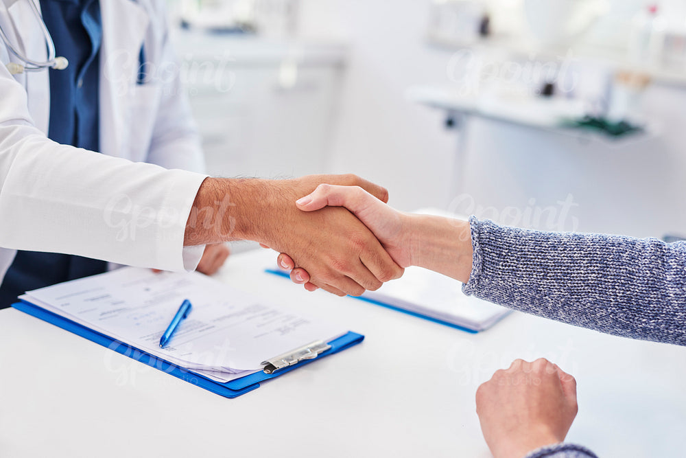 Detail of handshake of doctor and patient in doctor's office