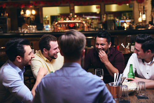 Group of friends enjoying time together in the pub