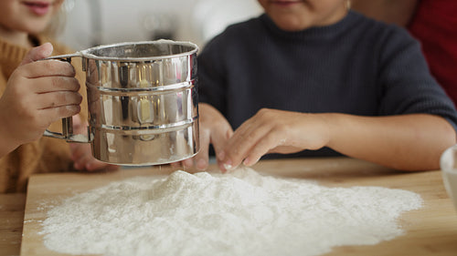 Video of children applying flour on bakeboard