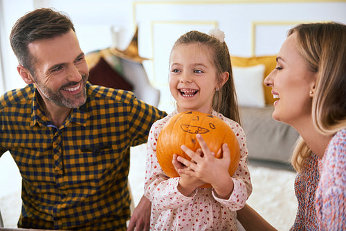 Happy family with halloween pumpkin