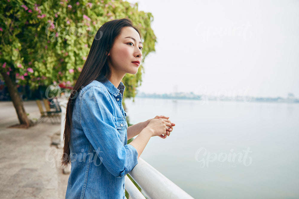 Beautiful Vietnamese woman enjoying the view in the city
