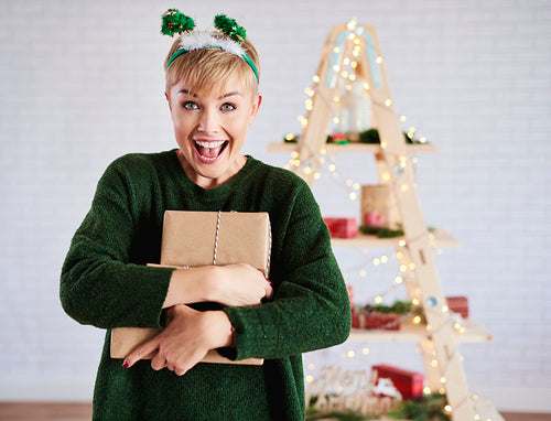 Screaming woman holding christmas present