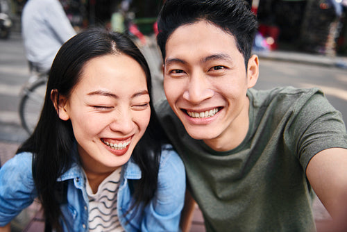 Selfie of Vietnamese couple in the city