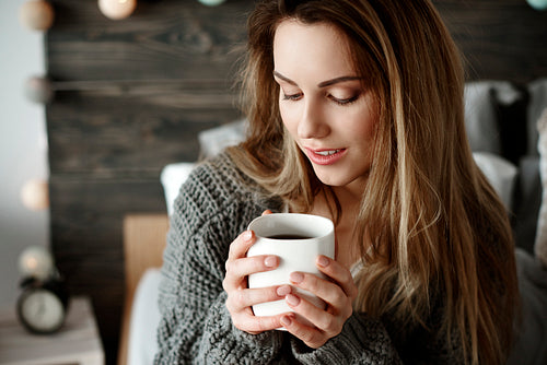 Attractive woman drinking morning coffee