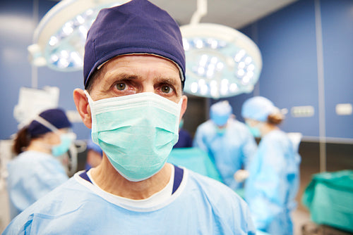 Portrait of senior surgeon in operating room