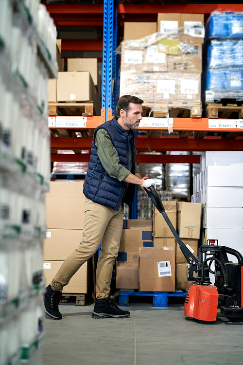 Adult caucasian man working in warehouse