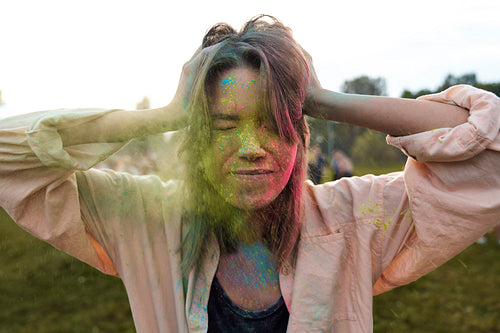 Face of woman with coloured powder at Holi Festival