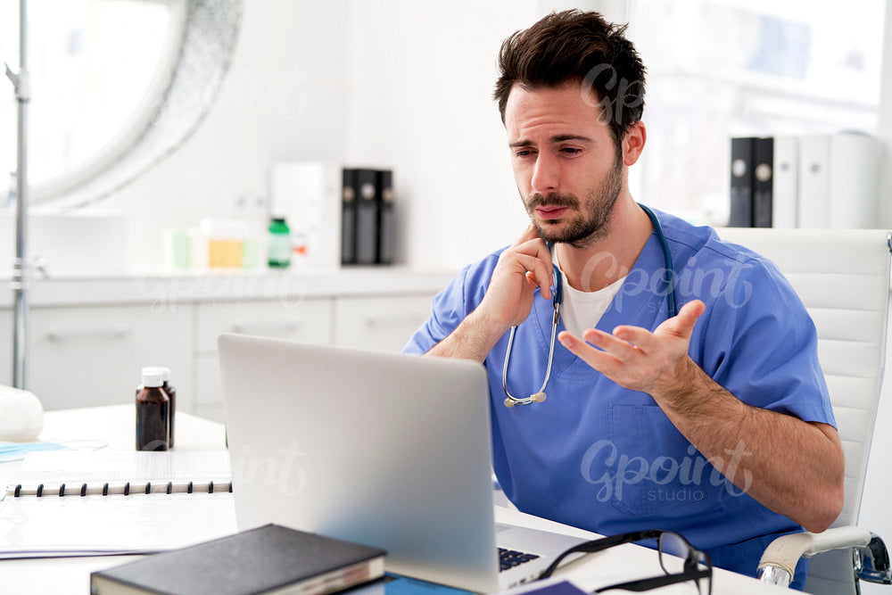 Young doctor making an online consultation