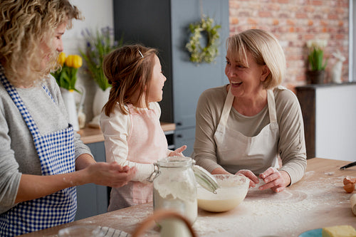 Happy three generations of women in the kitchen
