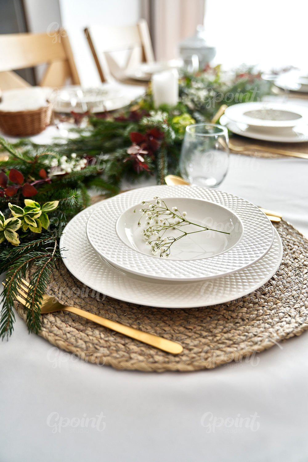 Close up of empty plate on table with Christmas decorations 