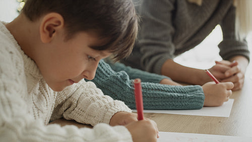 Video of children writing a letter to Santa Claus