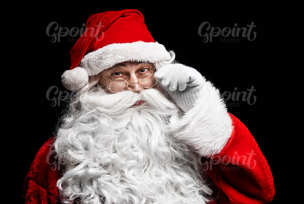 Portrait of cheerful santa claus with eyeglasses
