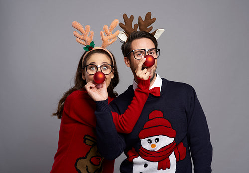 Portrait of playful couple in Christmas time