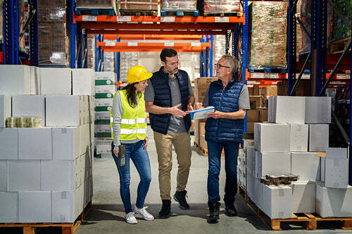 Group of caucasian people working at warehouse