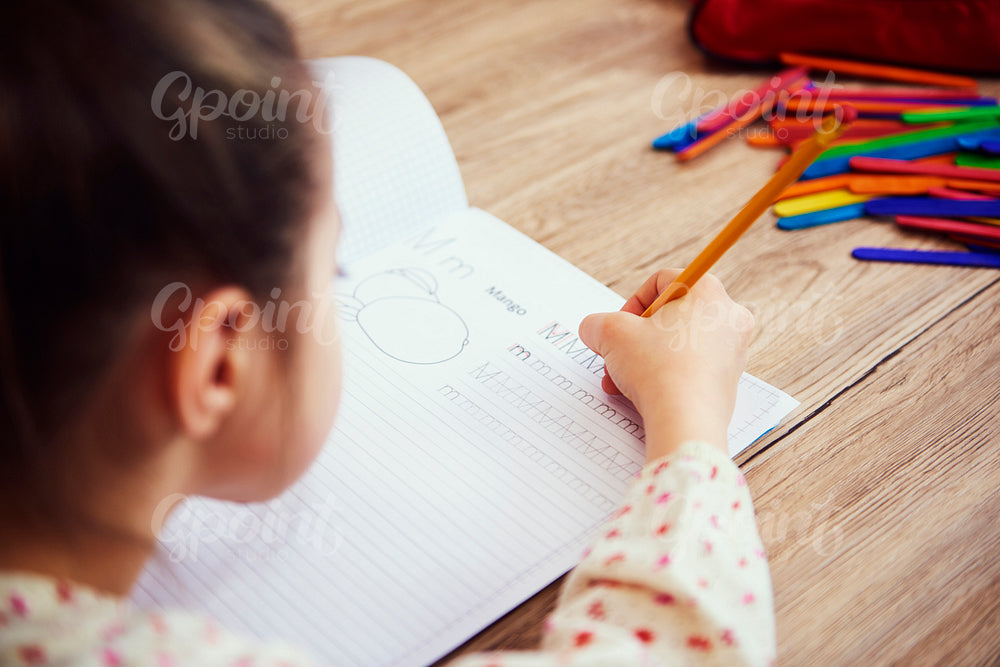 Close up of child doing homework