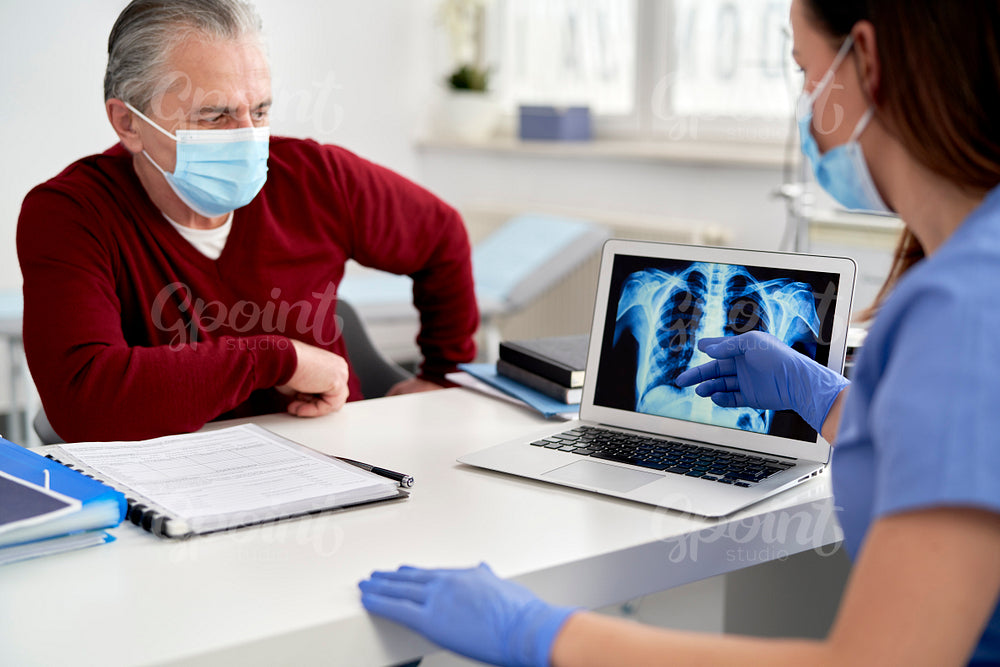 Doctor analyzing the patient's lung X-rays