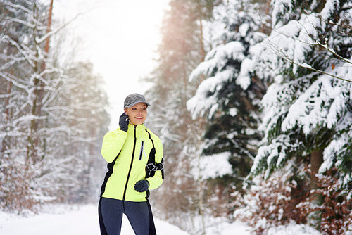 Modern runner in the winter forest