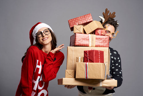 Couple with a stack of amazing Christmas presents