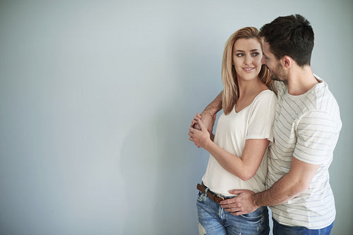 Embraced couple with big copy space